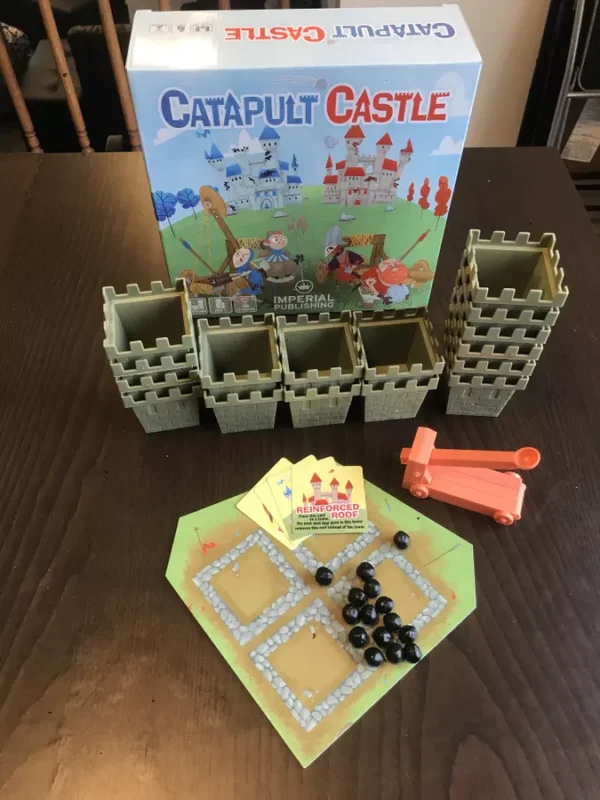 A Board Game of a Catapult Castle Theme